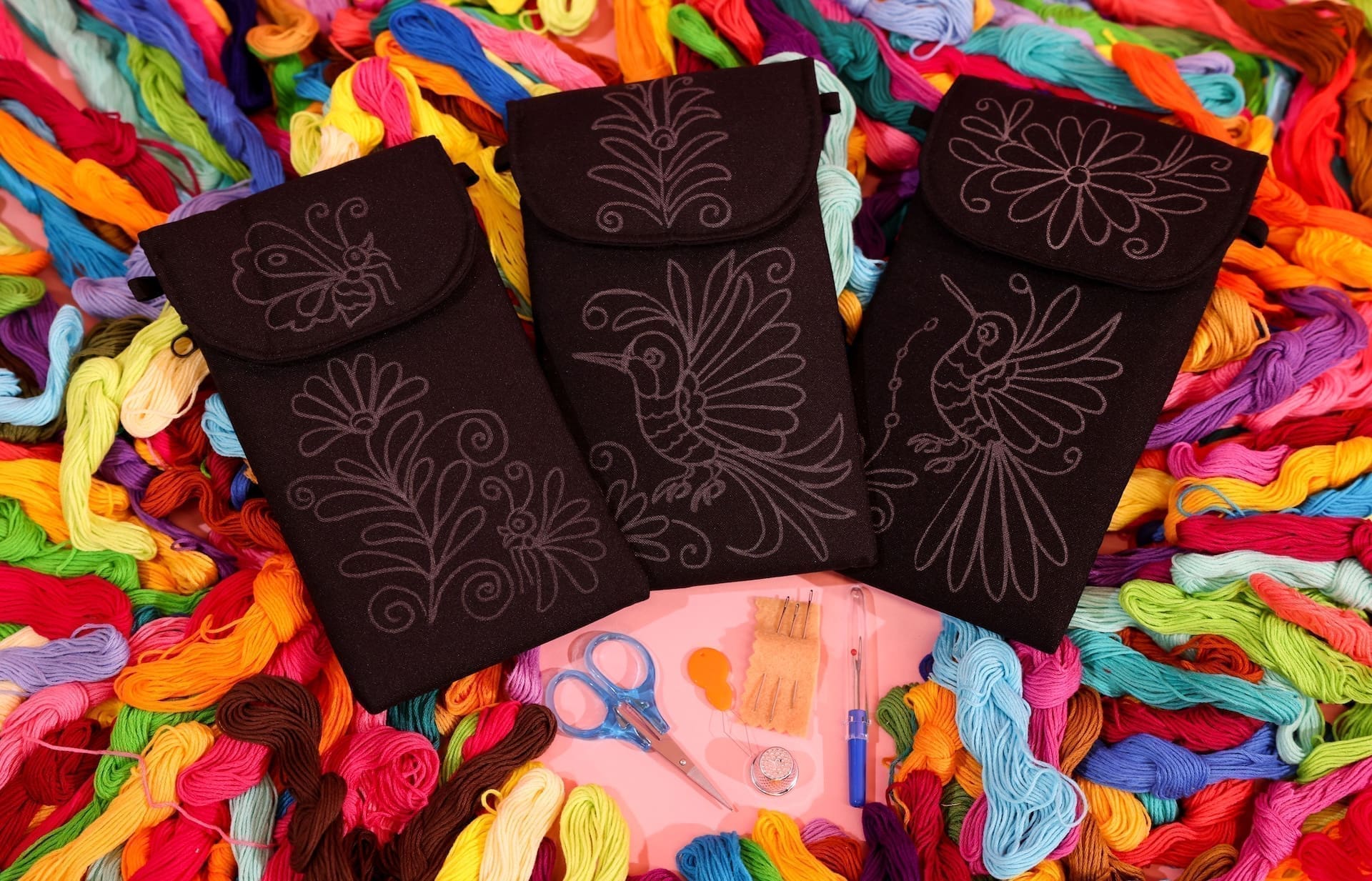 A photo of supplies for many craft kits, spread across a table.